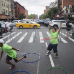 Children hula hoop and race on the streets of Harlem during Concrete Safari's 5th Annual Obstacle race and Active living fair in Harlem on August 29, 2017.